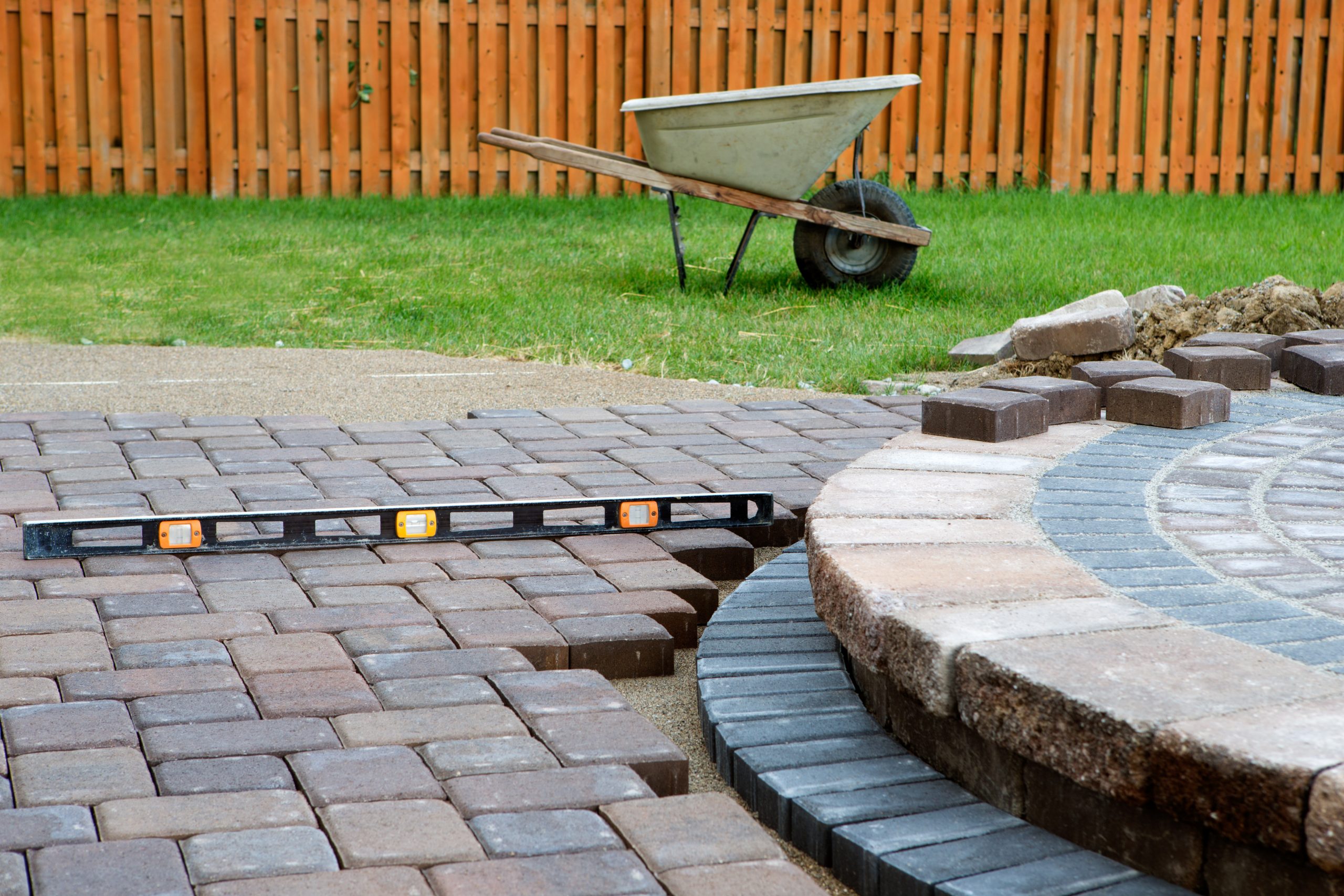 Patio stone and wheelbarrow on the grass