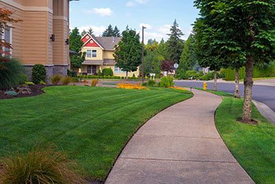 A House with Green Grass Lawn Front Yard Freshly Mowed | A-Z Landscaping